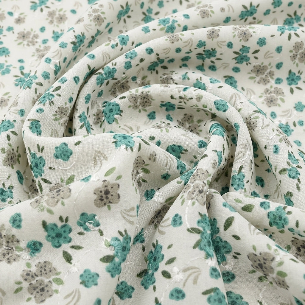 Swirled White Embroidery Cotton Fabric Showing Floral and Drape