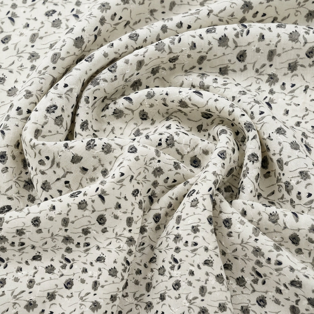Swirled White Embroidery Cotton Fabric Showing Floral and Drape