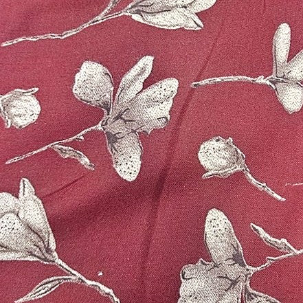 Maroon Floral Cotton Fabric, laid flat