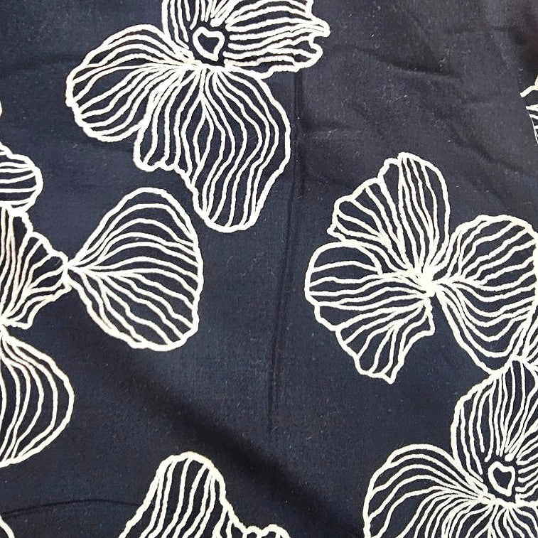 Black Floral Rayon Fabric, laid flat