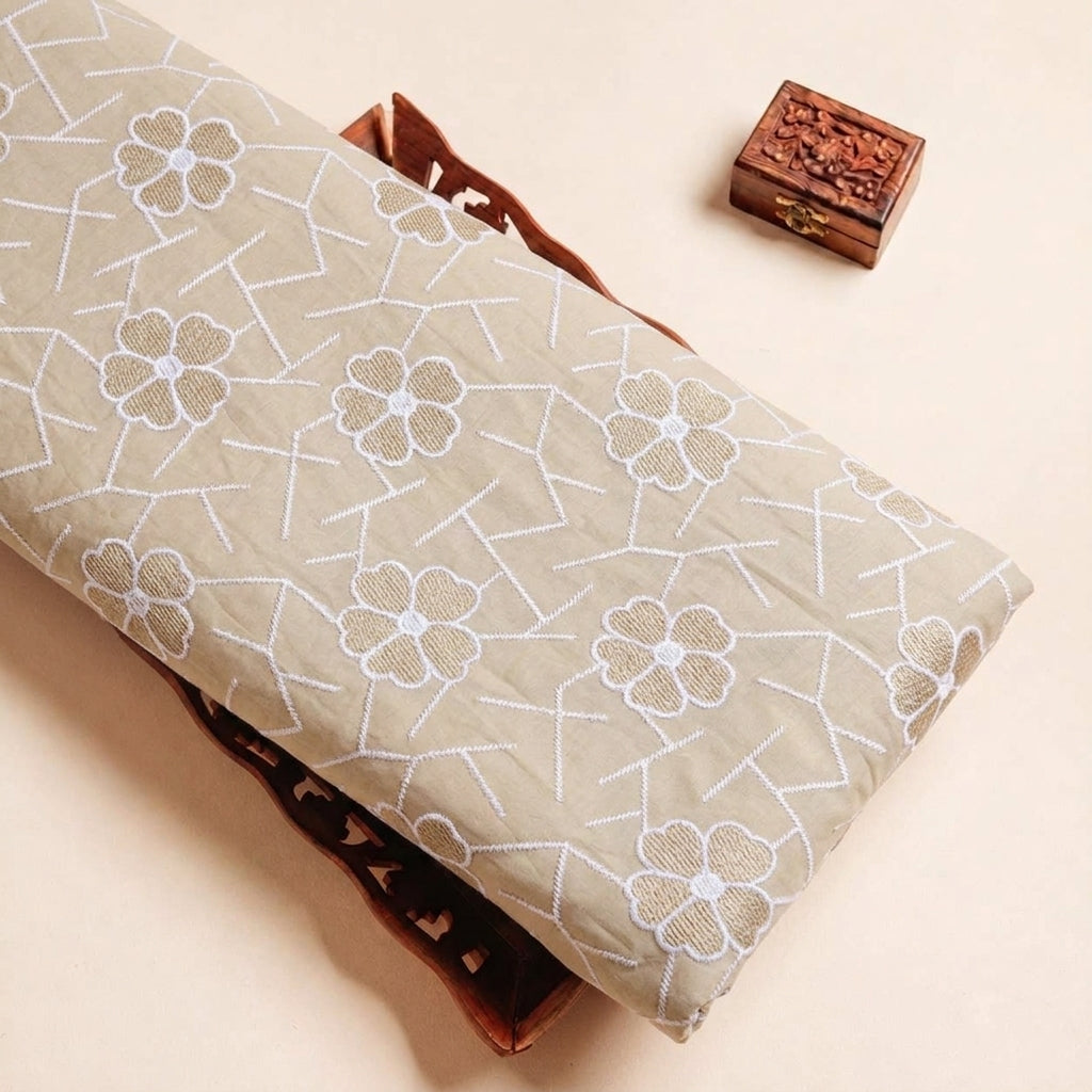 Folded Biege Embroidery Cotton Fabric Highlighting Thread Work Floral and Texture
