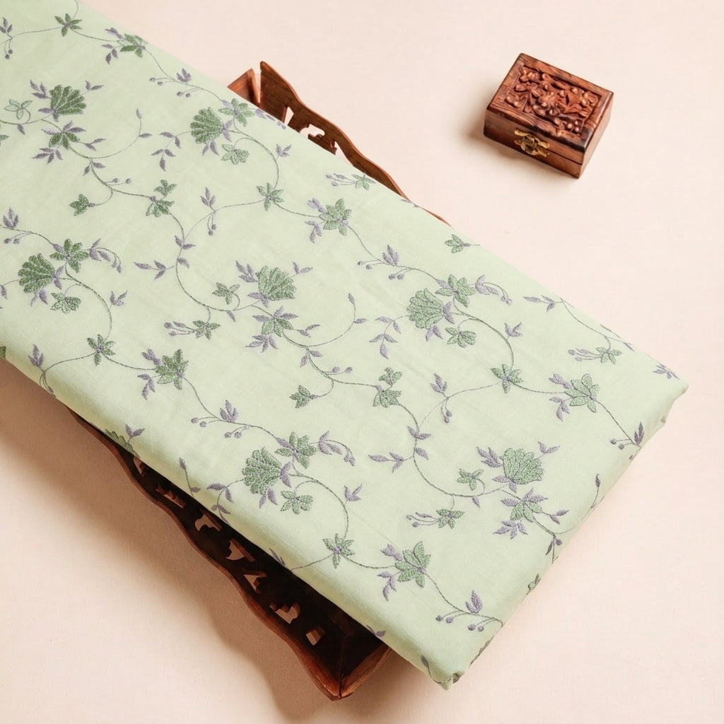 Folded Green Embroidery Cotton Fabric Highlighting Floral and Texture
