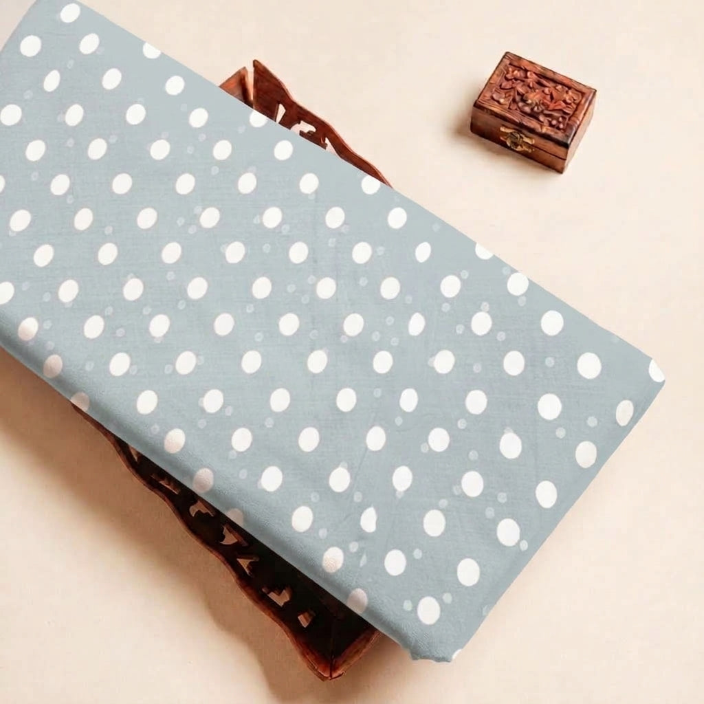 Folded Light Blue Polka Dot Cotton Fabric Highlighting Polyester Mix and Texture