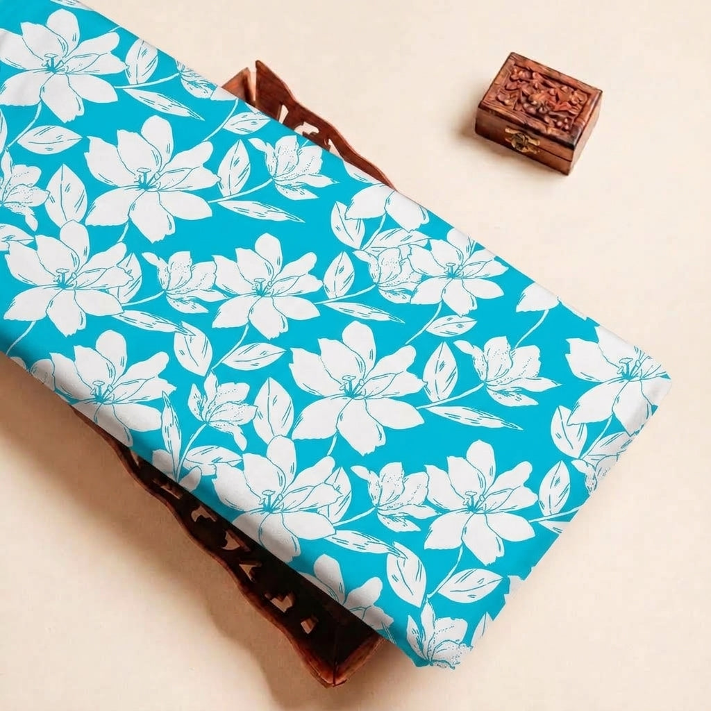 Folded Blue Floral Cotton Fabric Highlighting Polyester Mix and Texture