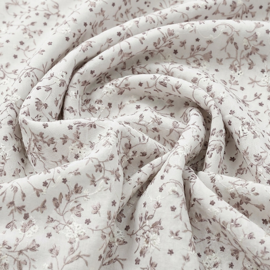 Swirled White Embroidery Cotton Fabric Showing Floral and Drape