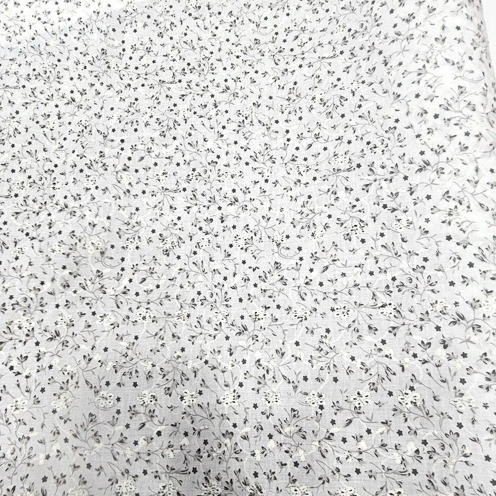 Black Cream Embroidery Cotton Fabric, laid flat