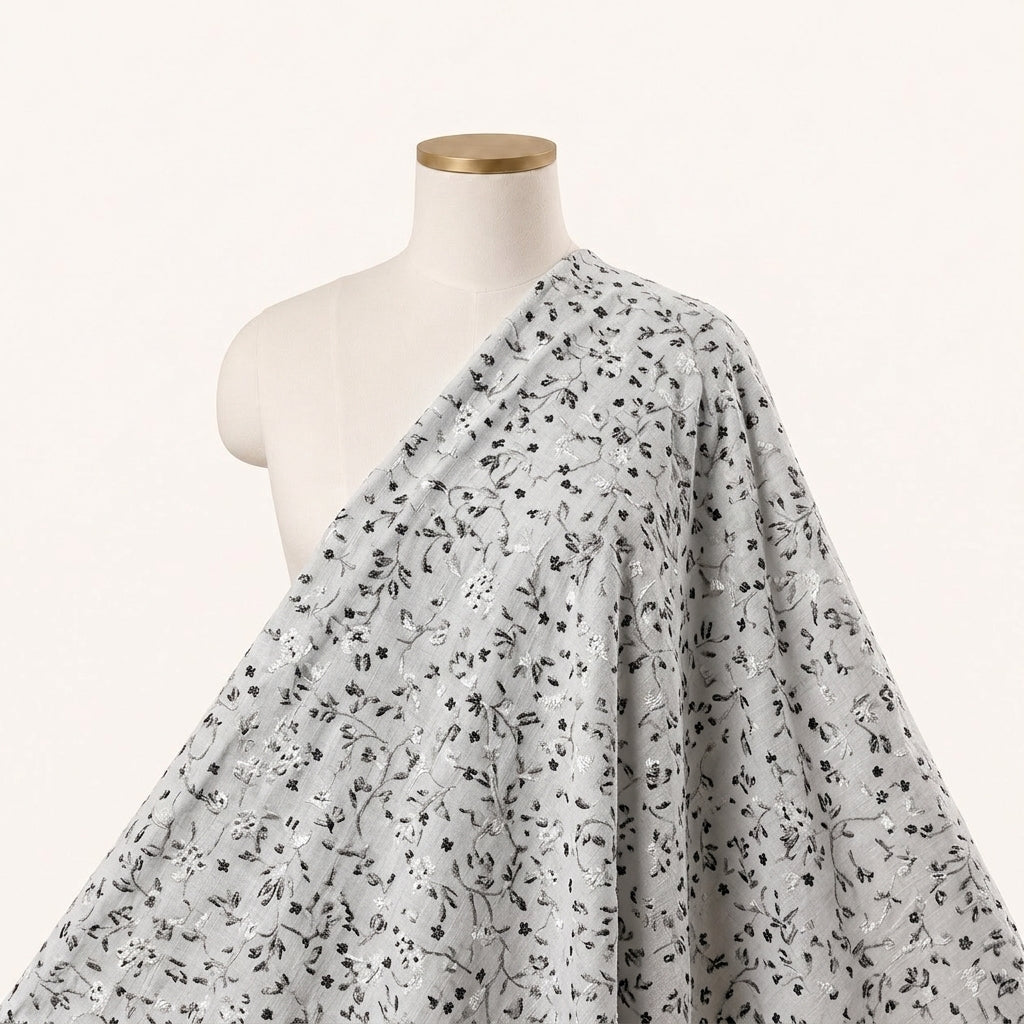 Black Cream Embroidery Cotton Fabric, draped as a saree