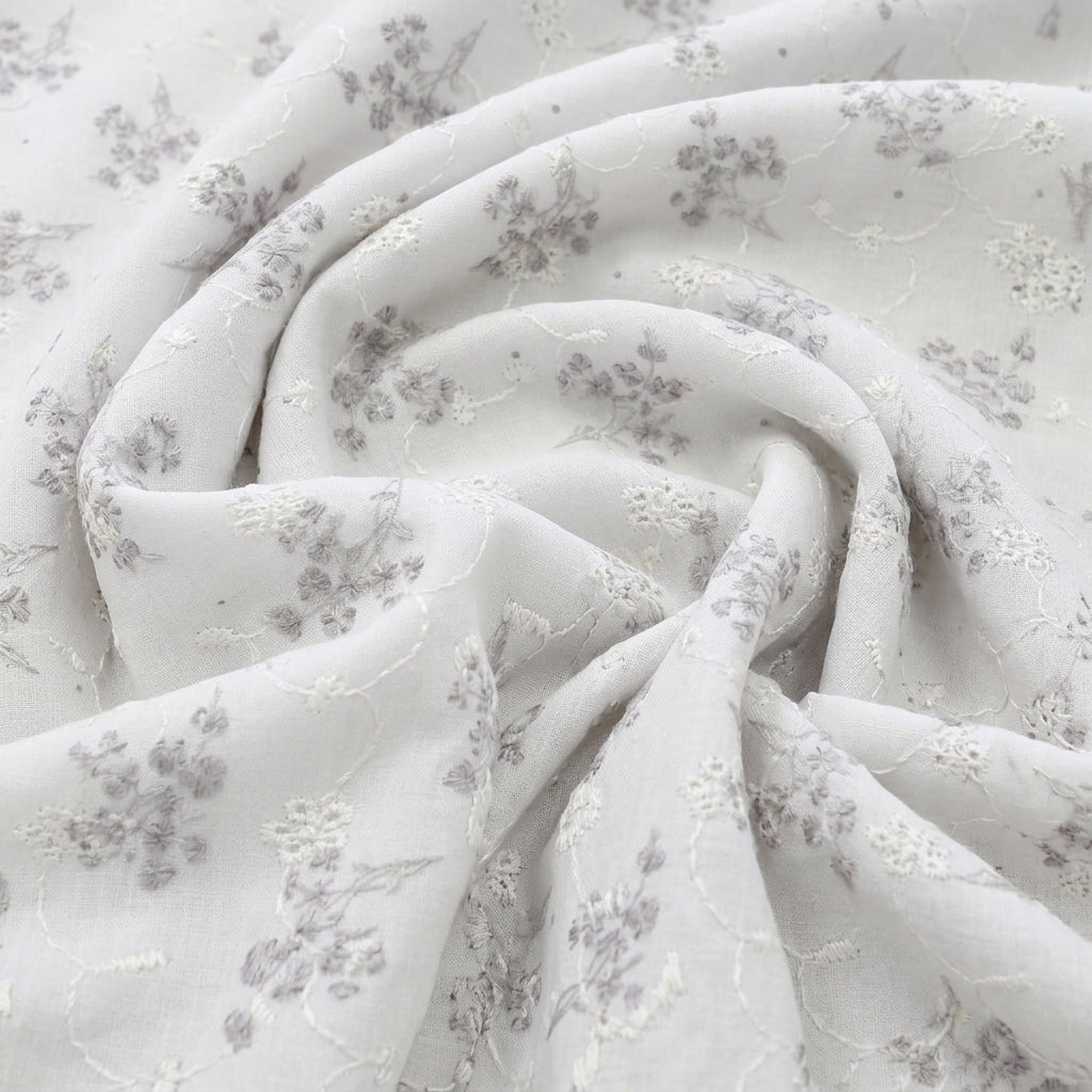 Swirled White Embroidery Cotton Fabric Showing Floral and Drape