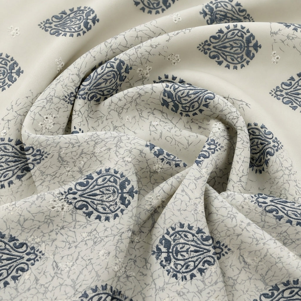 Blue Cream Embroidery Embroidery Fabric, swirled to show the drape