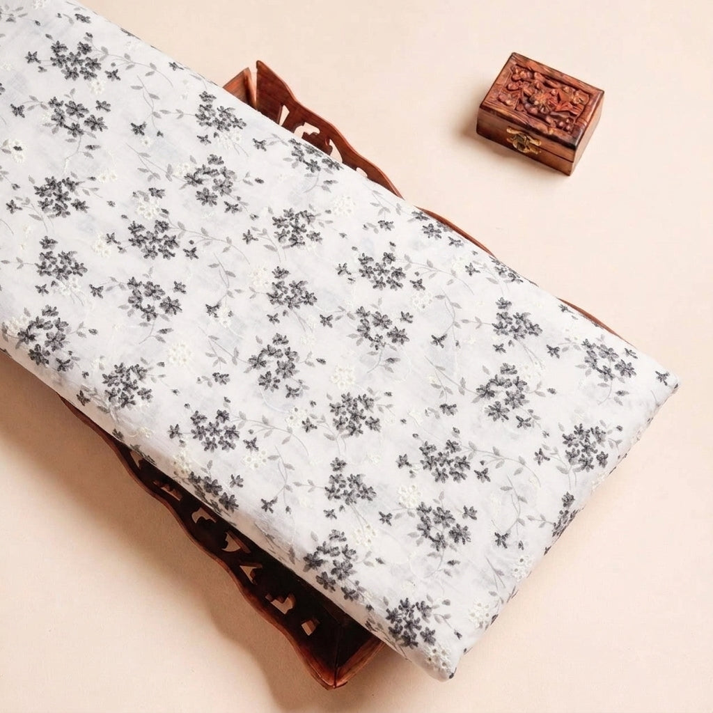 Folded Cream Embroidery Cotton Fabric Highlighting Floral and Texture