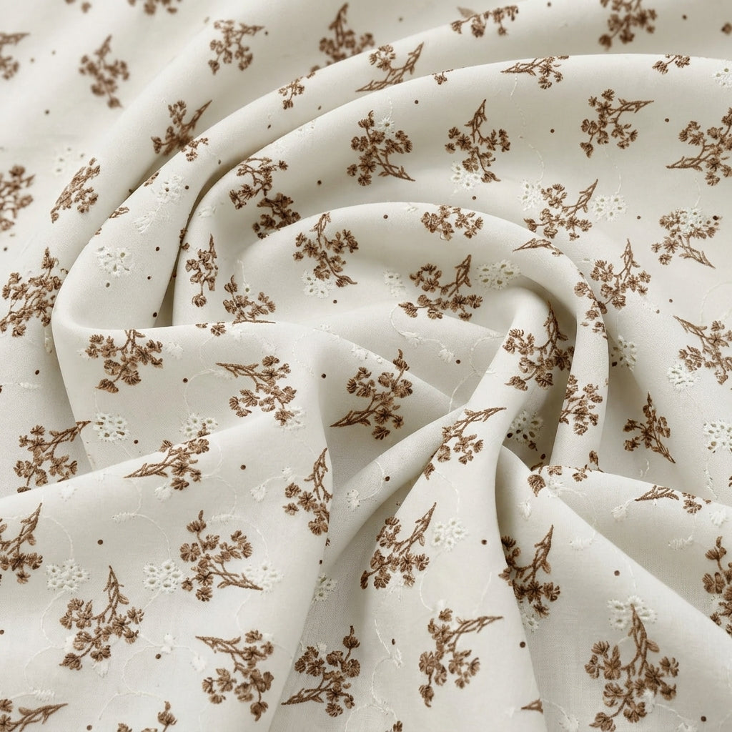 Brown Cream Embroidery Cotton Fabric, swirled to show the drape