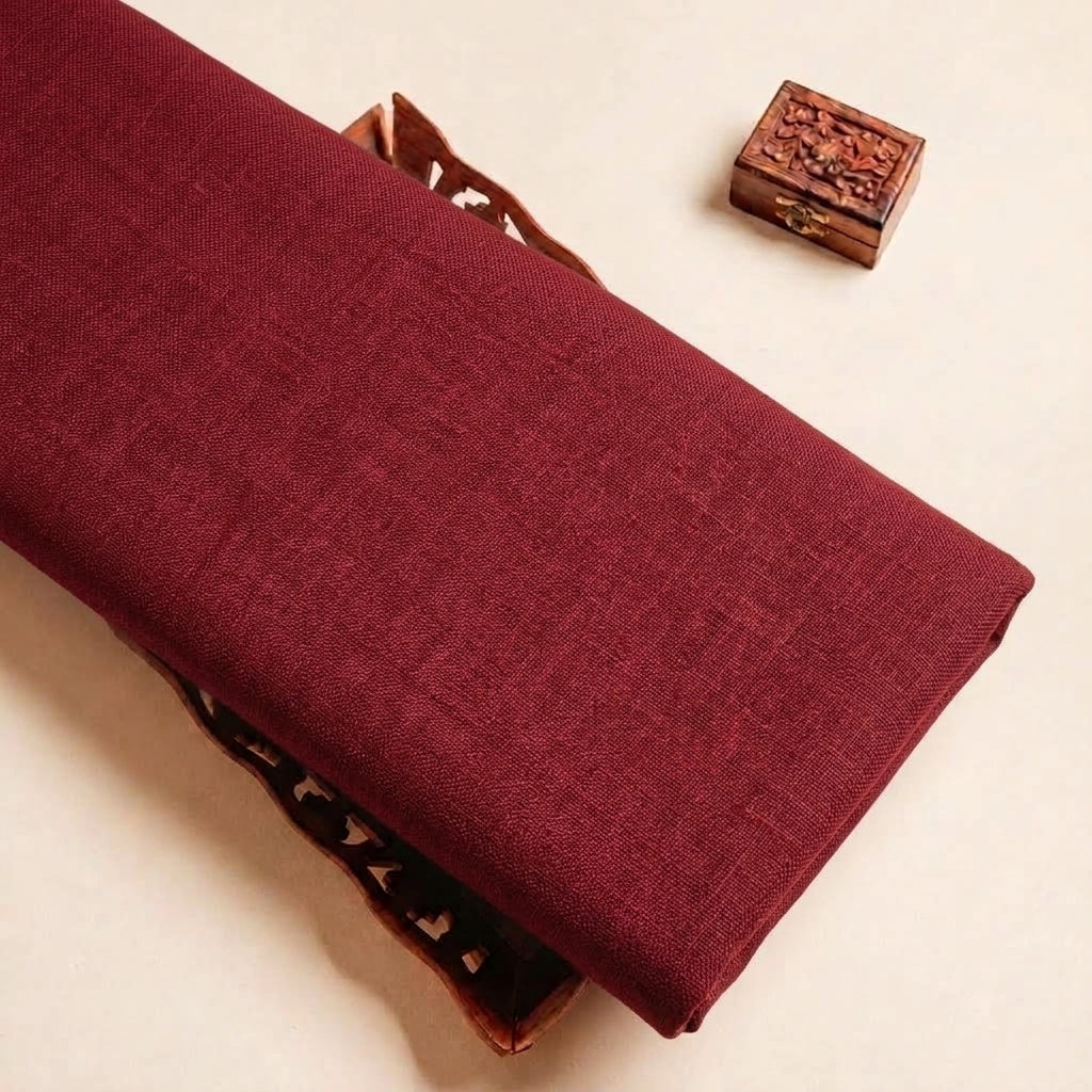 Folded Maroon Plain Cambric Cotton Fabric Highlighting and Texture
