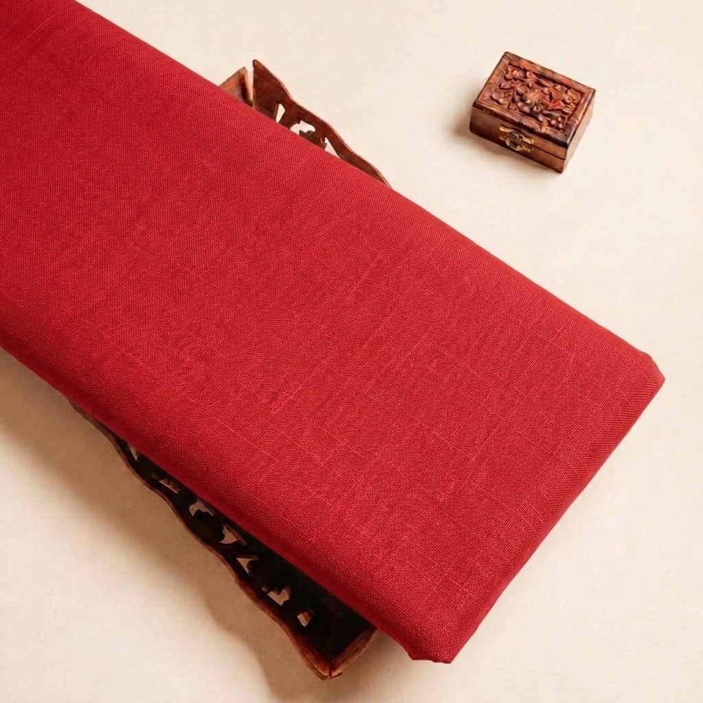 Folded Red Plain Cambric Cotton Fabric Highlighting and Texture